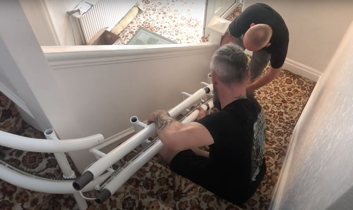 pushing the rail together on a stairlift installation