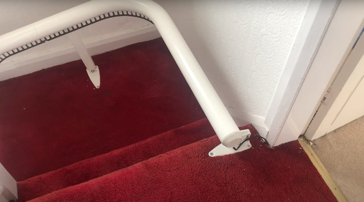 stair lift door at top of stairs